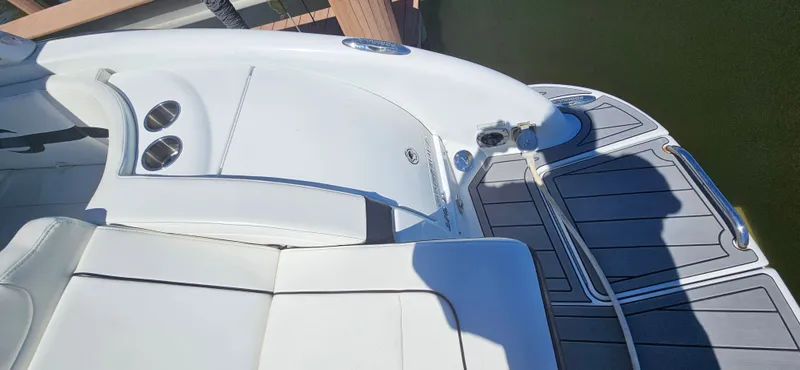 Slide: The Image of 2011 Formula 310 Bowrider boat deck with seating and cup holders. - 9
