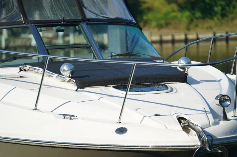Slide: The Image of 2010 Sea Ray 370 Sundancer yacht bow with sleek design and stainless steel railings. - 10