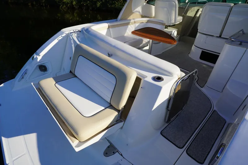 Slide: The Image of 2010 Sea Ray 370 Sundancer boat interior with seating and table. - 23