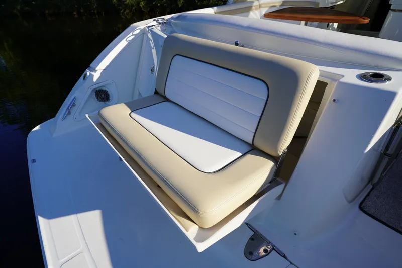 Slide: The Image of Luxury seating on 2010 Sea Ray 370 Sundancer boat deck, featuring beige and white upholstery. - 24