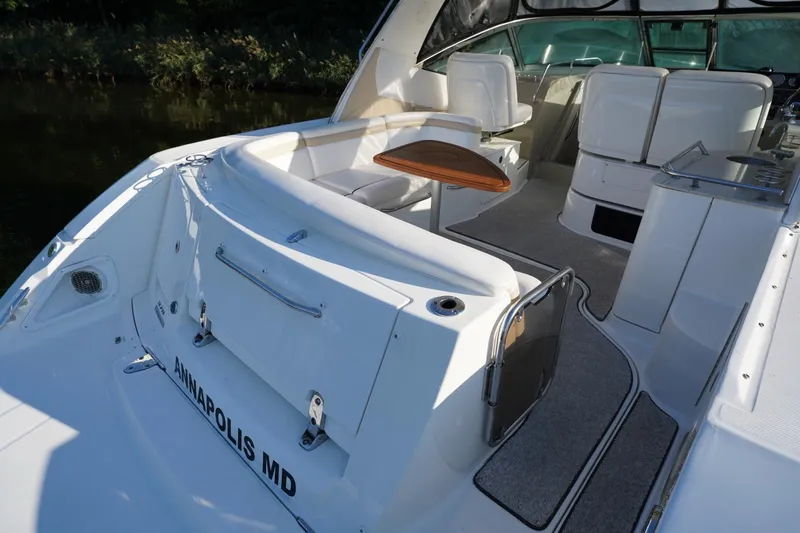 Slide: The Image of 2010 Sea Ray 370 Sundancer boat interior with seating and table, docked in Annapolis, MD. - 25