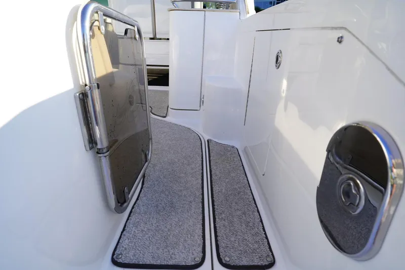 Slide: The Image of 2010 Sea Ray 370 Sundancer boat deck with carpeted steps and stainless steel fittings. - 27