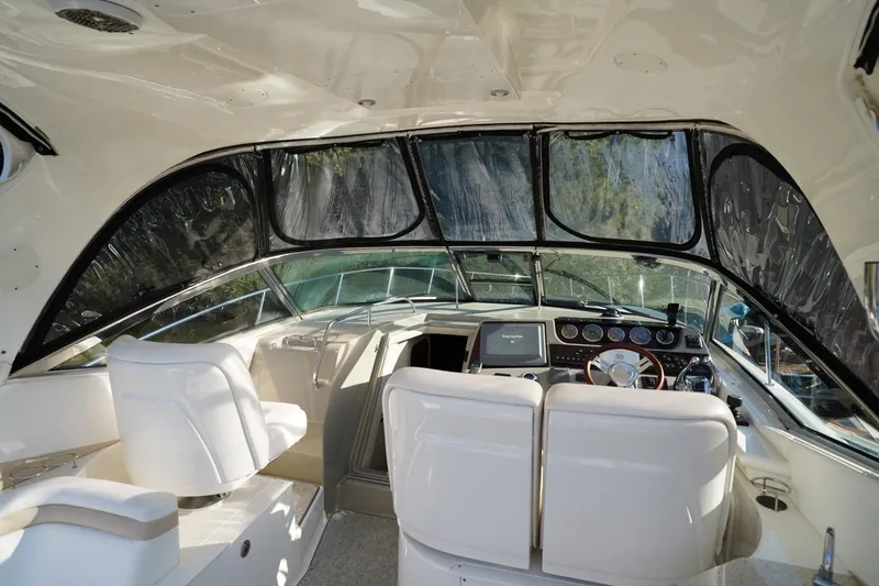 Slide: The Image of Interior of 2010 Sea Ray 370 Sundancer yacht with modern helm and seating. - 30