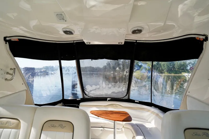 Slide: The Image of Interior view of 2010 Sea Ray 370 Sundancer yacht with seating and water backdrop. - 31