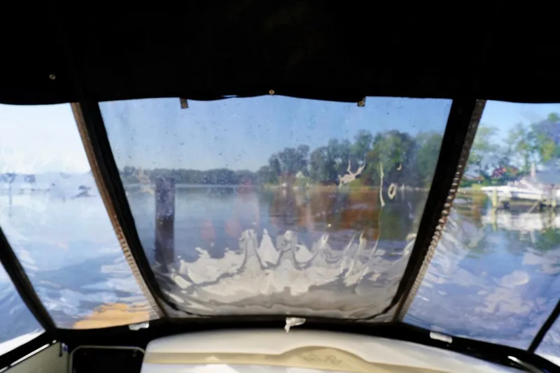 Slide: The Image of View from a 2010 Sea Ray 370 Sundancer boat through a clear canopy. - 33