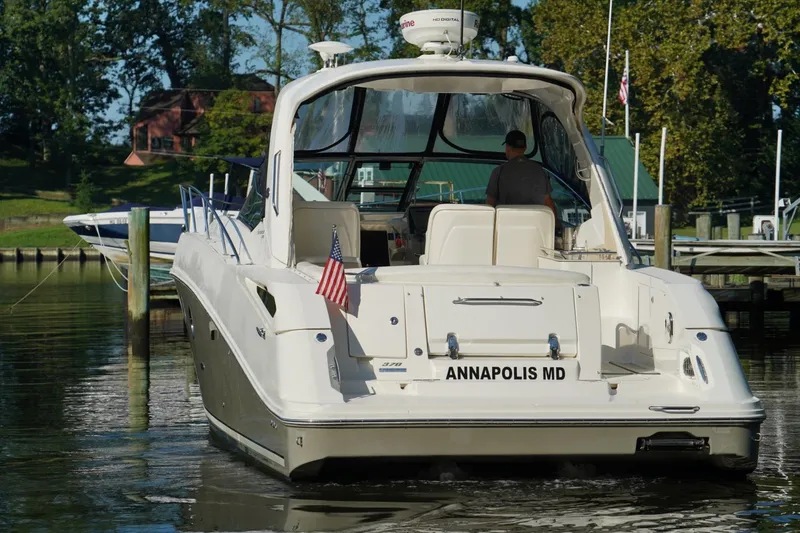 Slide: The Image of 2010 Sea Ray 370 Sundancer yacht docked in Annapolis, MD, with American flag. - 4