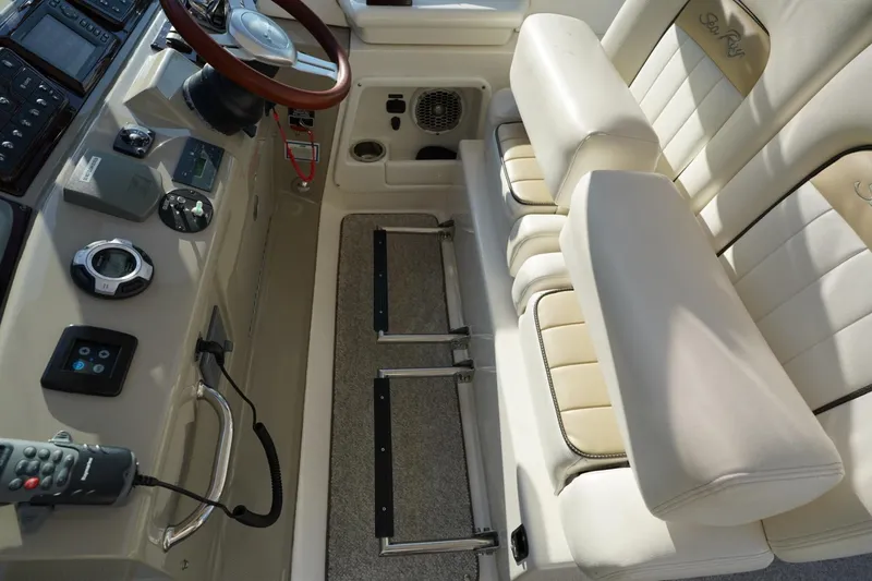 Slide: The Image of 2010 Sea Ray 370 Sundancer helm with leather seating and modern controls. - 40