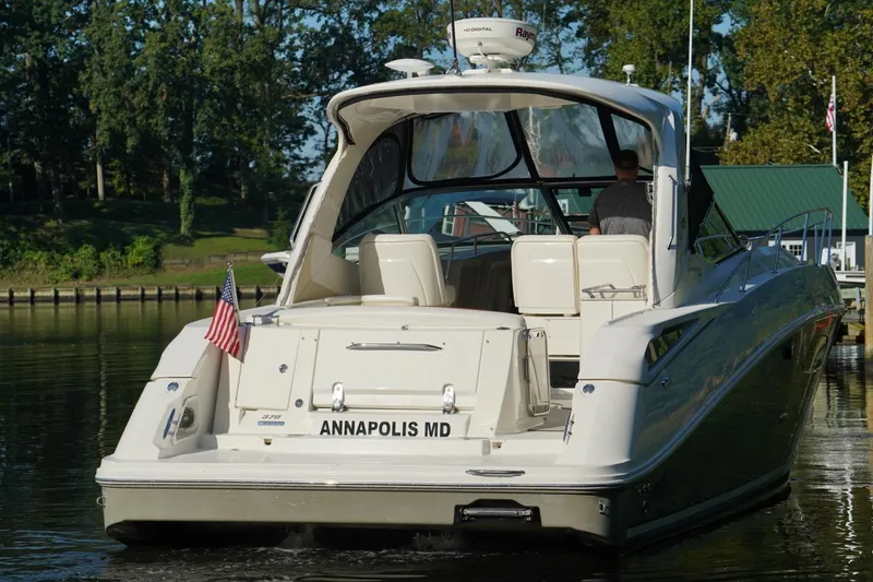 Slide: The Image of 2010 Sea Ray 370 Sundancer yacht docked in Annapolis, MD, with American flag. - 5