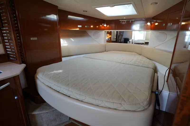 Slide: The Image of Luxurious interior cabin of 2010 Sea Ray 370 Sundancer yacht with cozy bed. - 54