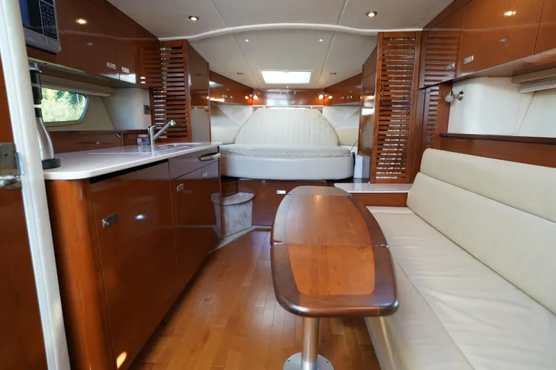 Slide: The Image of Luxurious interior of 2010 Sea Ray 370 Sundancer yacht with wood finishes and modern amenities. - 70