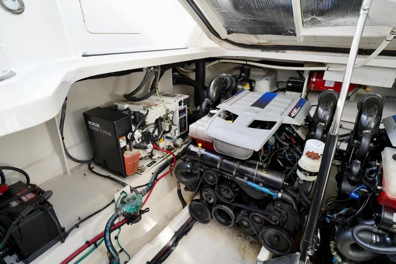 Slide: The Image of Engine compartment of 2010 Sea Ray 370 Sundancer with Kohler power system and MerCruiser engine. - 73