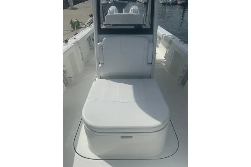 Slide: The Image of 2025 Parker 2600 Center Console boat interior with white cushioned seating. - 11