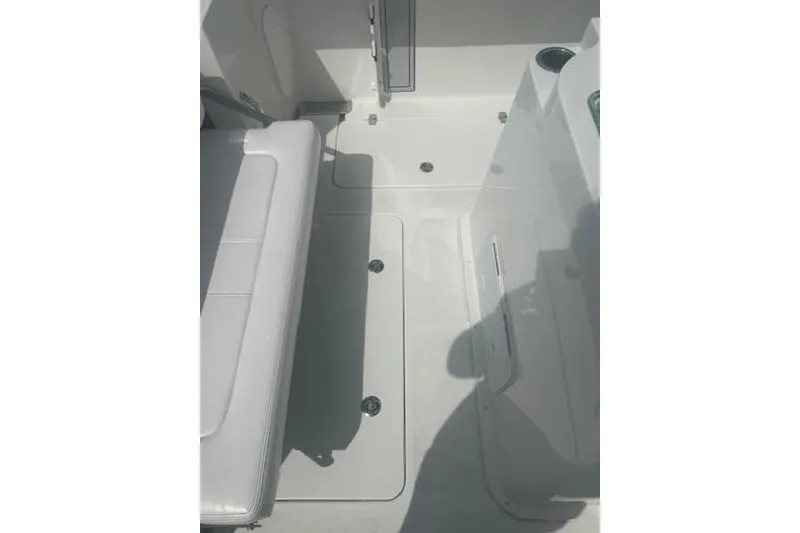 Slide: The Image of 2025 Parker 2600 Center Console boat interior with seating and storage compartments. - 12
