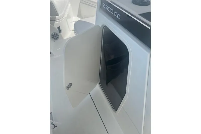 Slide: The Image of 2025 Parker 2600 Center Console boat with open storage compartment. - 5
