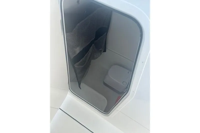 Slide: The Image of Interior storage compartment of 2025 Parker 2600 Center Console boat. - 7