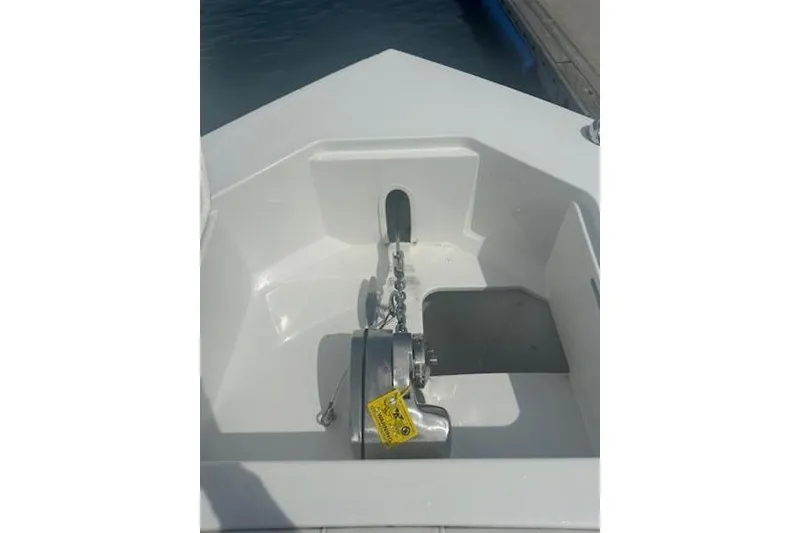 Slide: The Image of 2025 Parker 2600 Center Console boat anchor compartment with winch system. - 8