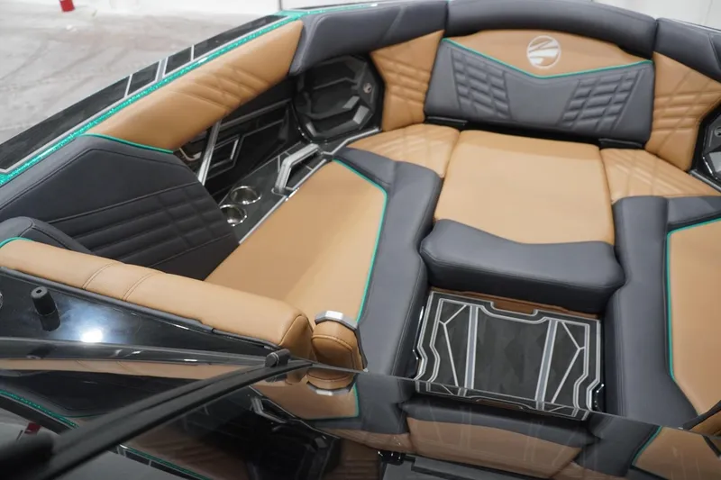 Slide: The Image of Luxurious interior of 2024 Tigé Ultré 25ZX boat with tan and gray seating. - 104