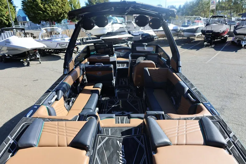 Slide: The Image of 2024 Tigé Ultré 25ZX boat interior with luxurious seating and modern design. - 15