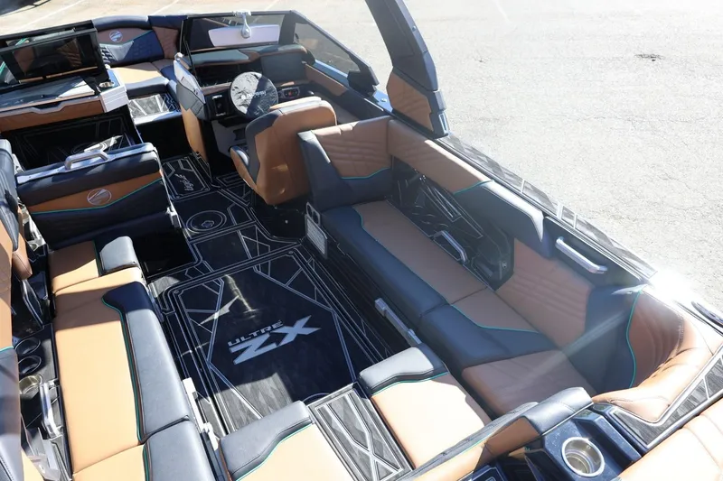 Slide: The Image of Luxurious interior of 2024 Tigé Ultré 25ZX boat with stylish seating and modern design. - 19