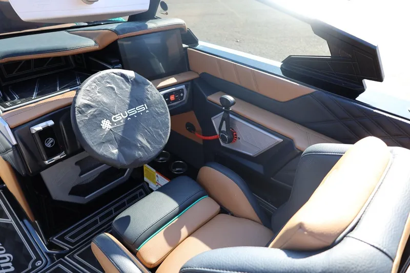 Slide: The Image of 2024 Tigé Ultré 25ZX boat interior with Gussi Italia steering wheel cover. - 21