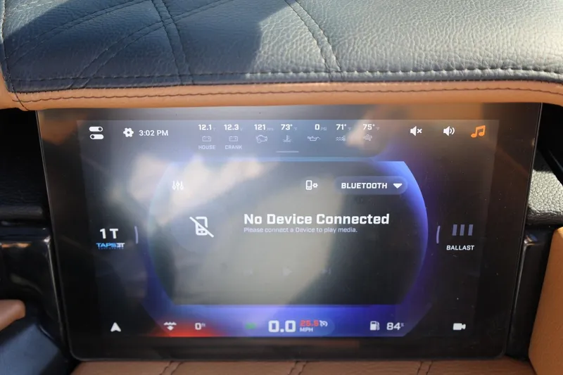 Slide: The Image of 2024 Tigé Ultré 25ZX dashboard display showing no device connected via Bluetooth. - 31