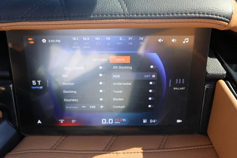 Slide: The Image of 2024 Tigé Ultré 25ZX touchscreen dashboard displaying lighting and ballast controls. - 34