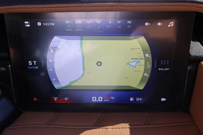 Slide: The Image of 2024 Tigé Ultré 25ZX dashboard display showing navigation map and controls. - 35