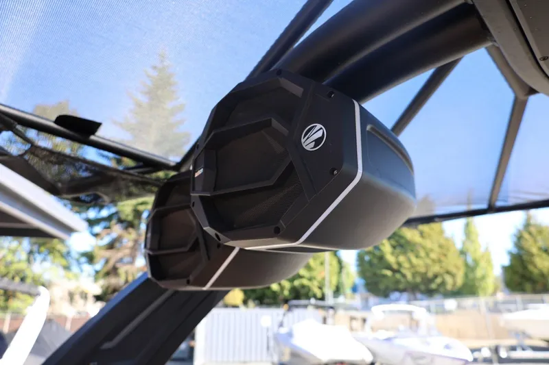 Slide: The Image of 2024 Tigé Ultré 25ZX boat speakers under canopy, showcasing modern audio design. - 41