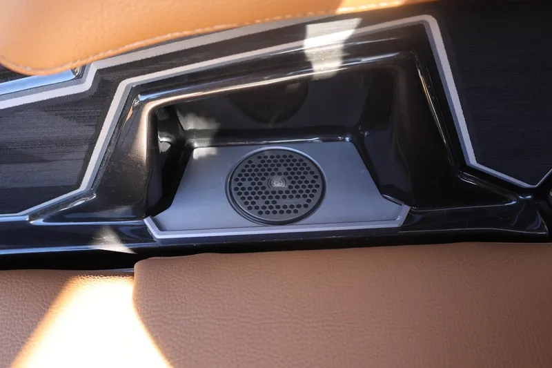 Slide: The Image of 2024 Tigé Ultré 25ZX interior speaker detail with sleek design and leather accents. - 42