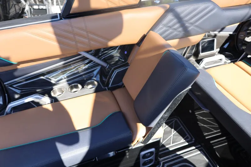 Slide: The Image of 2024 Tigé Ultré 25ZX interior with luxurious tan and black seating, modern design elements. - 45