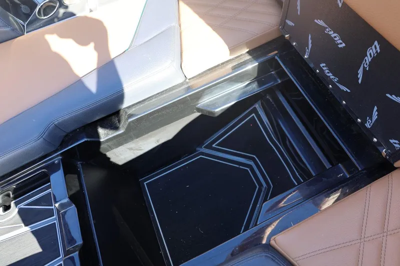 Slide: The Image of 2024 Tigé Ultré 25ZX boat interior storage compartment with stylish seating. - 57