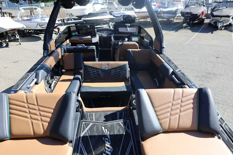 Slide: The Image of 2024 Tigé Ultré 25ZX boat interior with luxurious seating and modern design. - 61