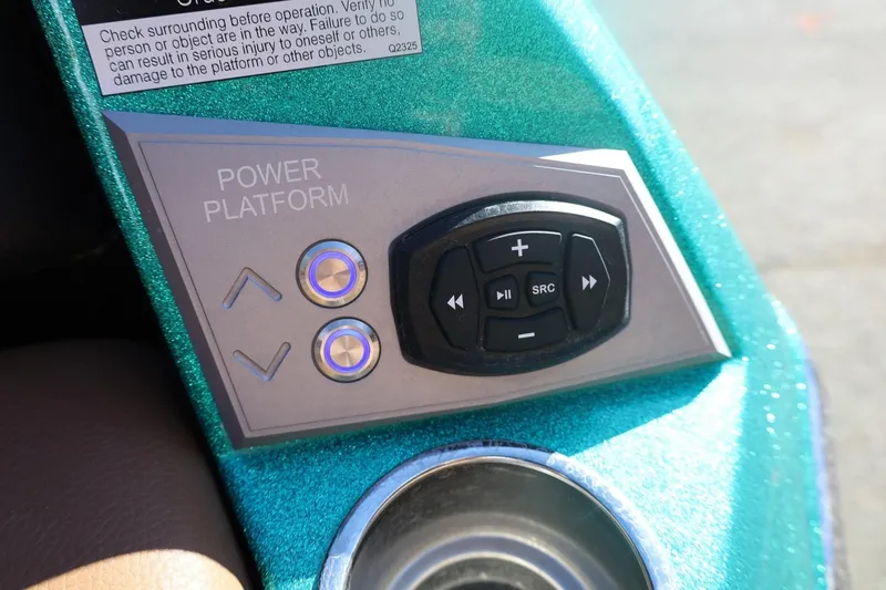 Slide: The Image of Control panel of 2024 Tigé Ultré 25ZX boat with power platform buttons. - 63