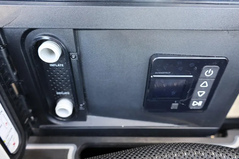 Slide: The Image of Control panel of 2024 Tigé Ultré 25ZX boat with inflate and deflate options. - 67