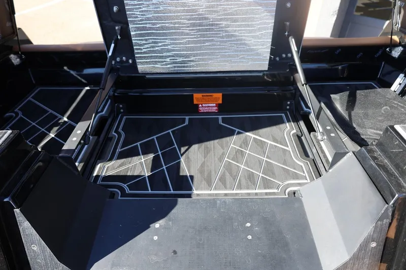 Slide: The Image of 2024 Tigé Ultré 25ZX boat interior with geometric flooring design. - 69