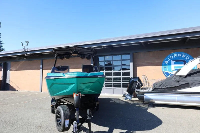 Slide: The Image of 2024 Tigé Ultré 25ZX boat on trailer outside dealership. - 7