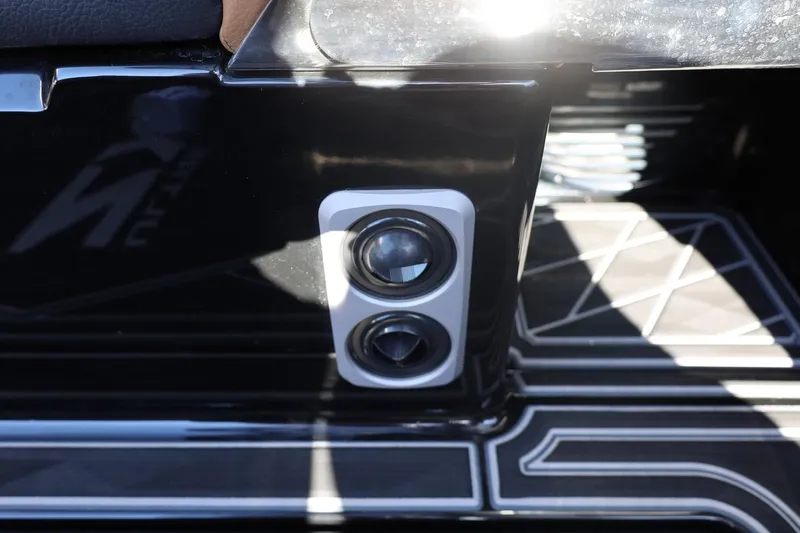 Slide: The Image of 2024 Tigé Ultré 25ZX boat interior detail with sleek black and white design. - 74