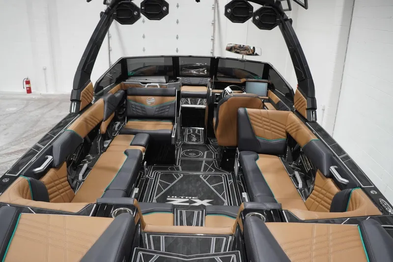 Slide: The Image of 2024 Tigé Ultré 25ZX boat interior with luxurious seating and modern design. - 81