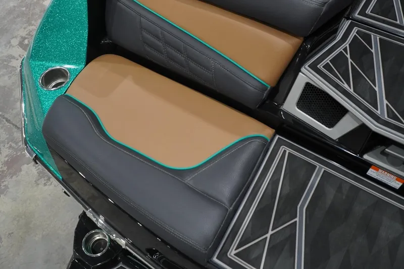 Slide: The Image of 2024 Tigé Ultré 25ZX boat interior with stylish seating and cup holder. - 84