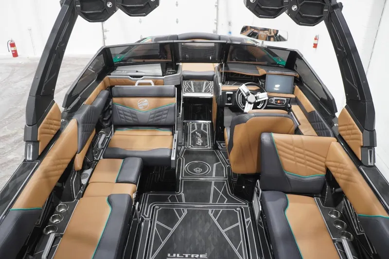 Slide: The Image of 2024 Tigé Ultré 25ZX boat interior with luxurious seating and modern dashboard design. - 88
