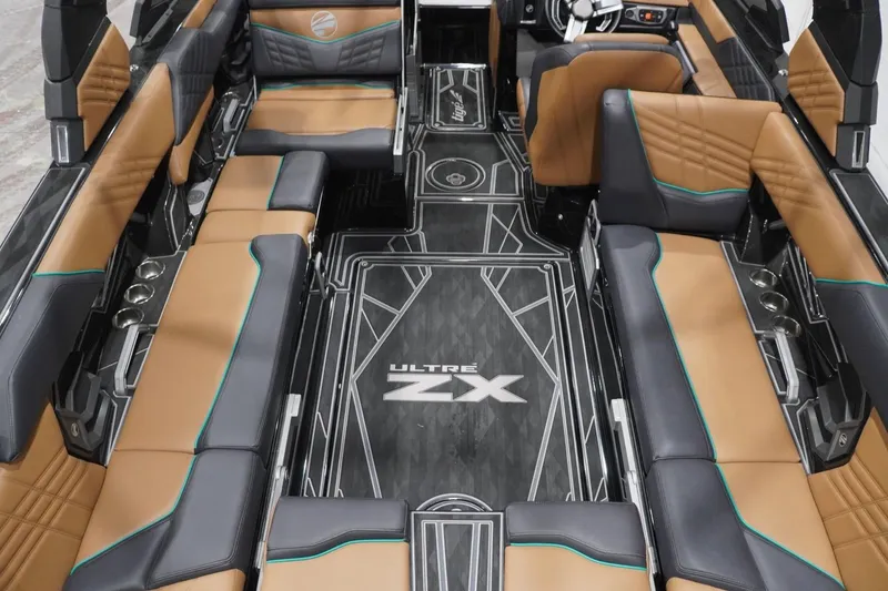 Slide: The Image of 2024 Tigé Ultré 25ZX boat interior with luxurious seating and modern design. - 89