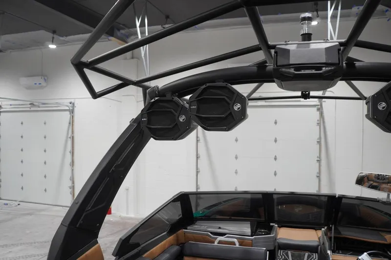 Slide: The Image of 2024 Tigé Ultré 25ZX boat interior with advanced audio system and sleek design. - 95