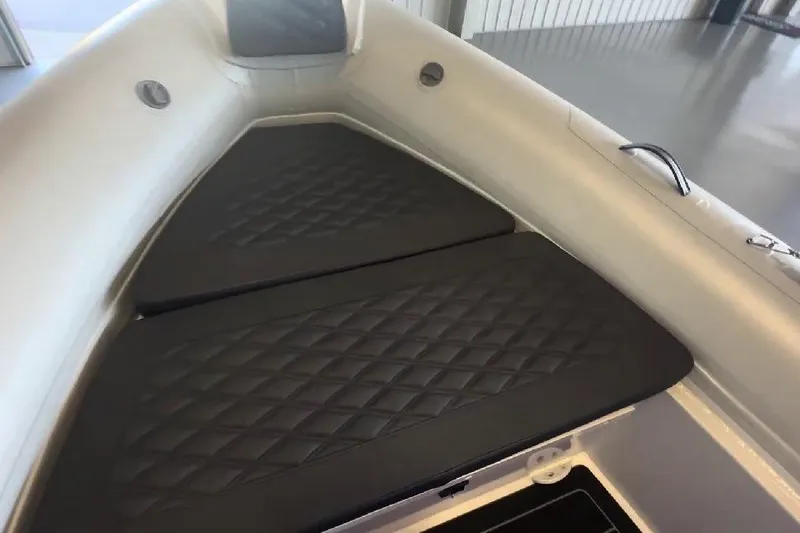 Slide: The Image of 2024 Highfield Sport 660 boat interior with quilted seating and sleek design. - 10