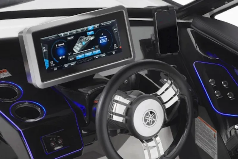 Slide: The Image of 2026 Yamaha Boats 275SE dashboard with touchscreen display and steering wheel. - 2