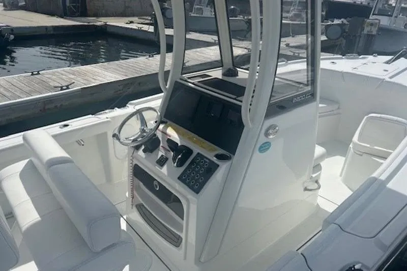 Slide: The Image of 2025 Parker 2200 Center Console boat interior with modern dashboard and steering wheel. - 4
