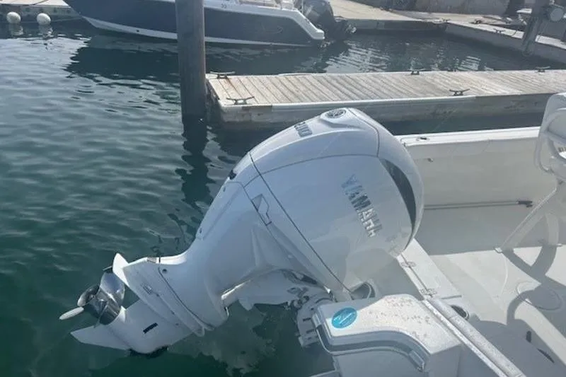 Slide: The Image of 2025 Parker 2200 Center Console boat with Yamaha outboard motor at dock. - 5