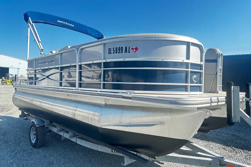 The Image of 2018 Berkshire 22CL CTS Pontoon boat on trailer under clear blue sky. - 0