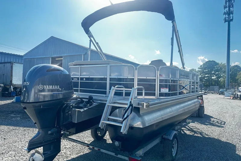 Slide: The Image of 2018 Berkshire 22CL CTS Pontoon with Yamaha engine on trailer, outdoor setting. - 3