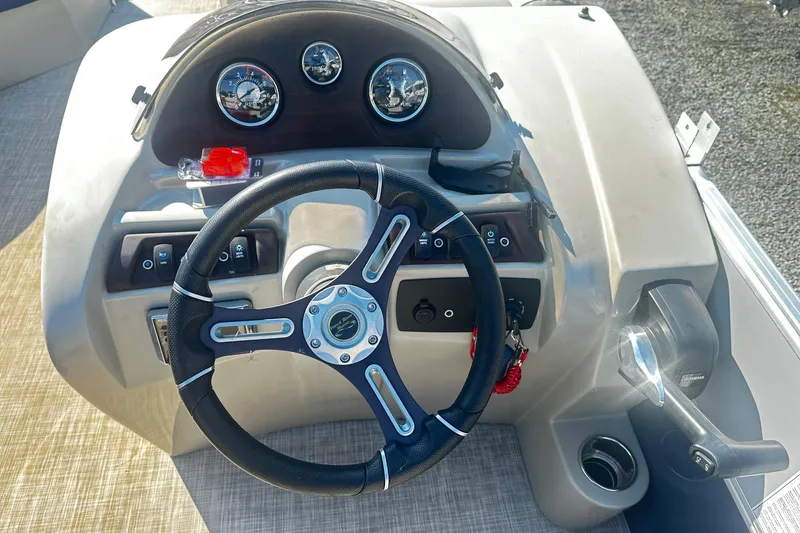Slide: The Image of Steering console of 2018 Berkshire 22CL CTS Pontoon with gauges and controls. - 4