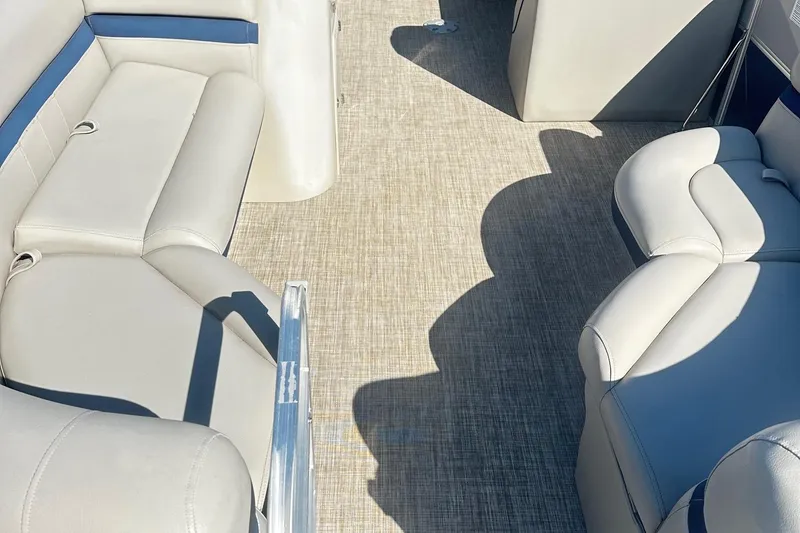 Slide: The Image of 2018 Berkshire 22CL CTS Pontoon interior with beige seating and carpet flooring. - 7